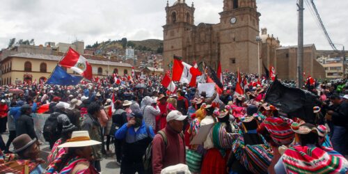 Demonstrators hold a protest against the government of President Dina Boluarte and to demand her resignation, in Puno, Peru, on January 19, 2023. - After weeks of unrest, thousands of protesters were expected to descend on Peru's capital Lima, defying a state of emergency to express their anger with President Dina Boluarte, who called on the demonstrators to gather "peacefully and calmly". The South American country has been rocked by over five weeks of deadly protests since the ouster and arrest of her predecessor Pedro Castillo in early December. (Photo by Juan Carlos CISNEROS / AFP)